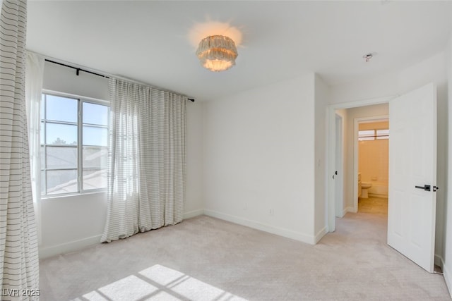 empty room with light colored carpet