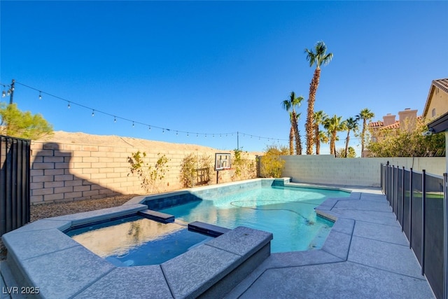 view of pool featuring an in ground hot tub