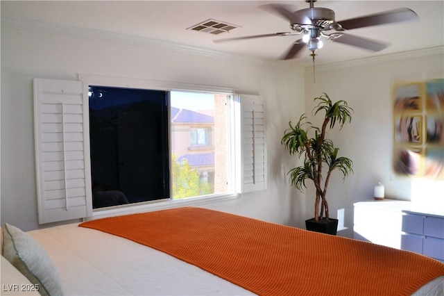 bedroom featuring ceiling fan and ornamental molding