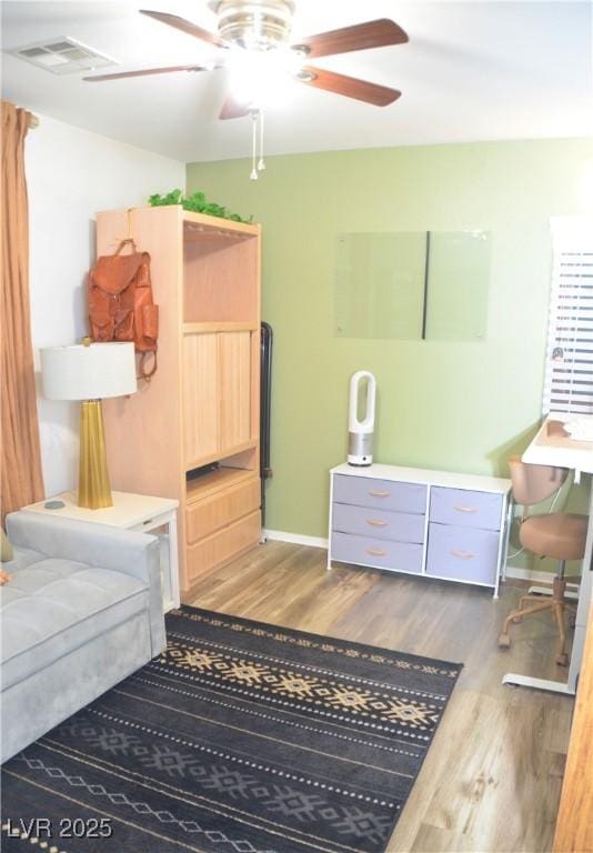 bedroom featuring ceiling fan and dark hardwood / wood-style flooring