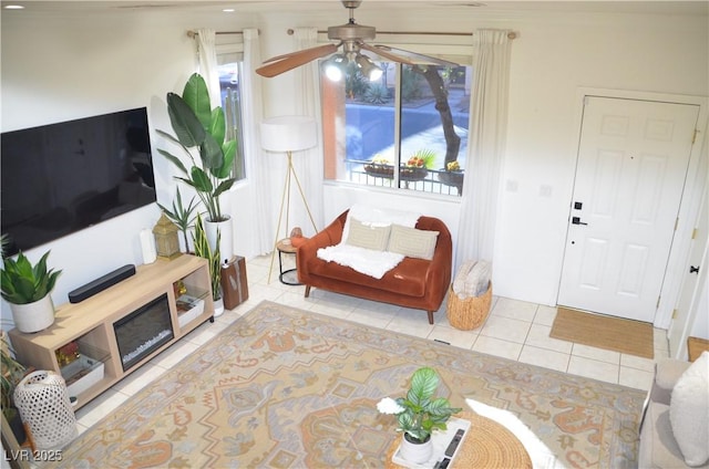 interior space with ceiling fan and light tile patterned floors