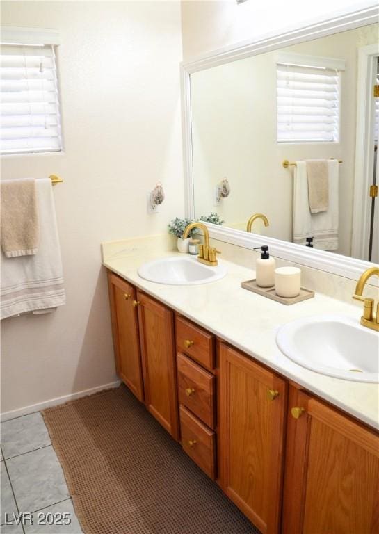 bathroom with tile patterned floors and vanity