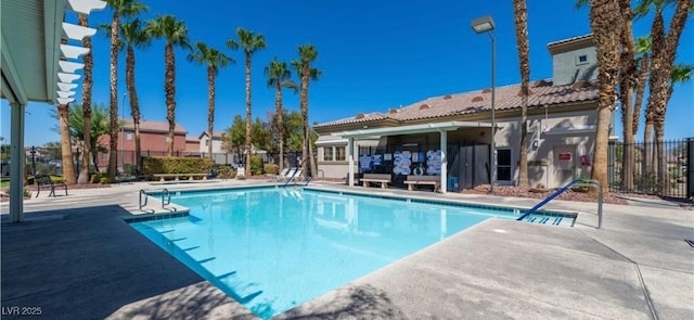 view of swimming pool featuring a patio