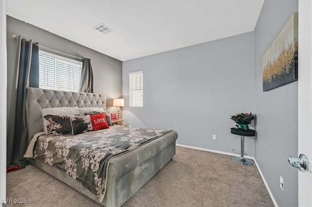 bedroom with light carpet and multiple windows