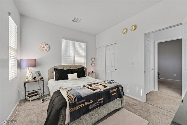 carpeted bedroom featuring a closet