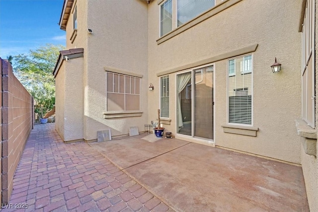 back of house with a patio area