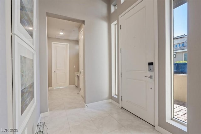 tiled foyer with plenty of natural light