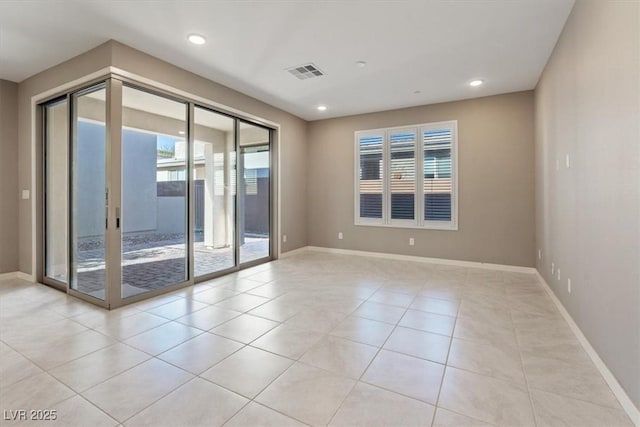 empty room featuring light tile patterned floors