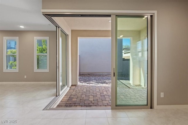 entryway featuring light tile patterned floors