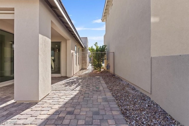 view of side of property with a patio