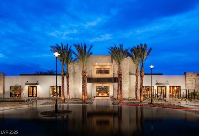 view of outdoor building at dusk