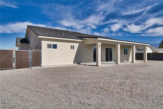 rear view of house featuring a patio