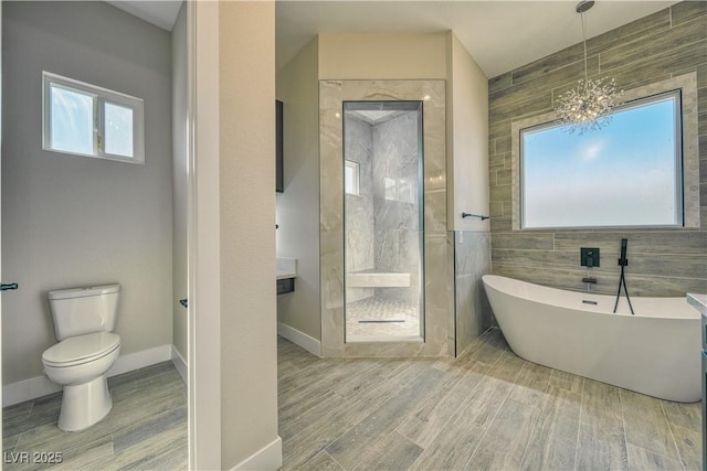 bathroom with toilet, independent shower and bath, and tile walls