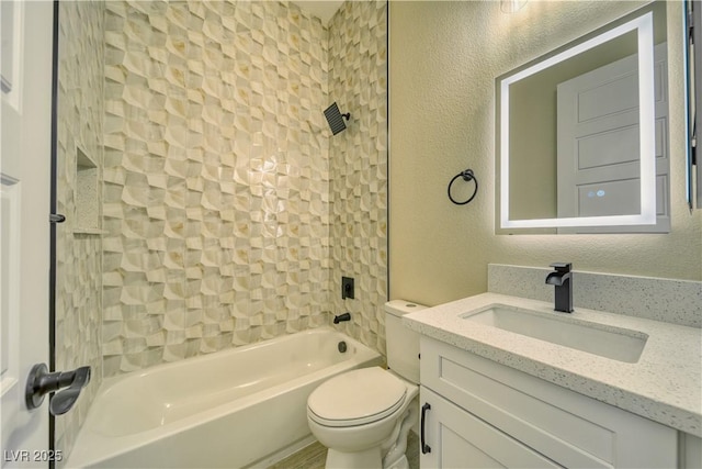 full bathroom with vanity, toilet, and tiled shower / bath