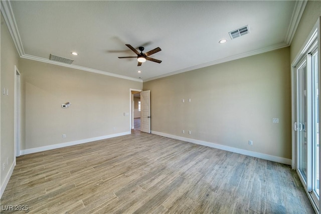 spare room with crown molding, ceiling fan, and light wood-type flooring