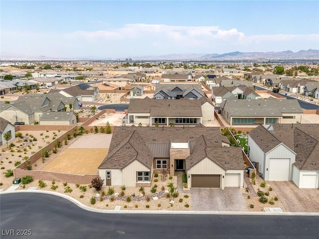 birds eye view of property with a mountain view