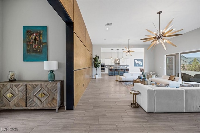 living room featuring a chandelier