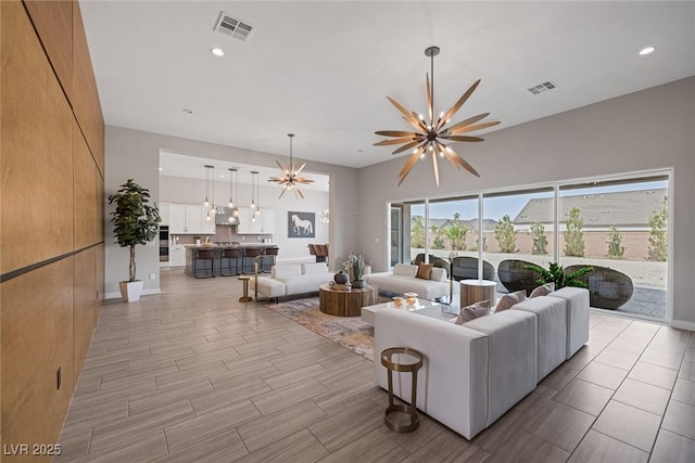 living room featuring a notable chandelier