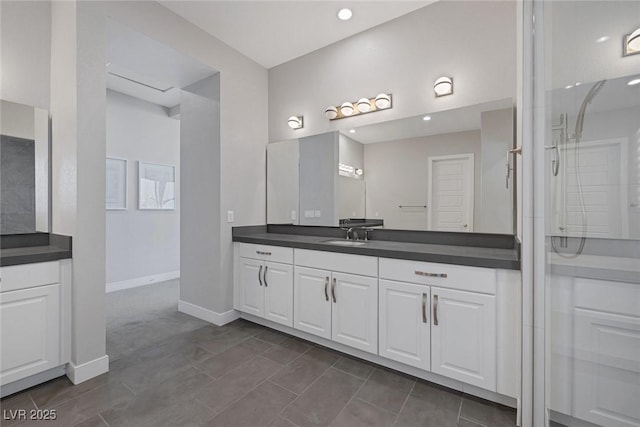 bathroom featuring vanity and a shower with shower door