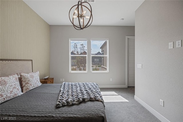 bedroom featuring carpet and a chandelier