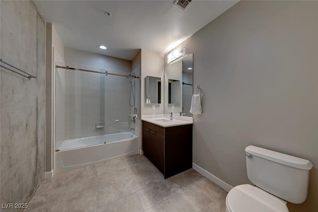 full bathroom with tiled shower / bath combo, toilet, and vanity