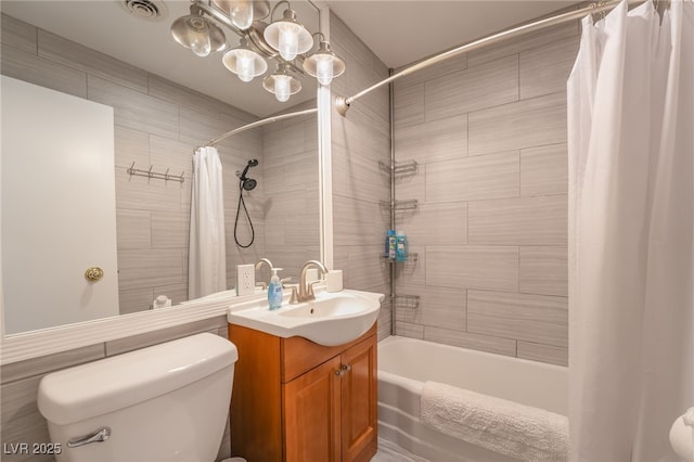 full bathroom featuring shower / bath combo, vanity, and toilet