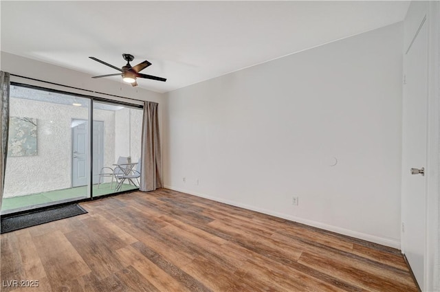 unfurnished room with hardwood / wood-style floors and ceiling fan