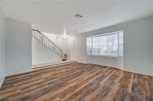 unfurnished living room with hardwood / wood-style flooring