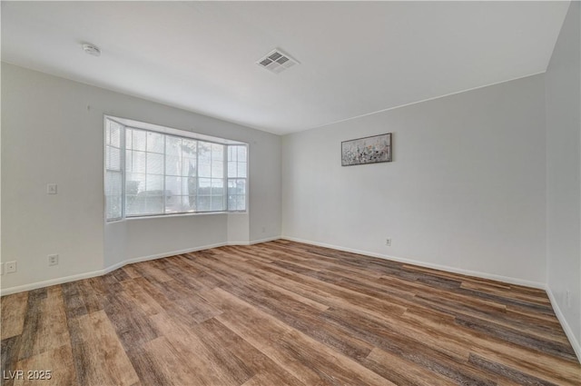 unfurnished room featuring hardwood / wood-style floors