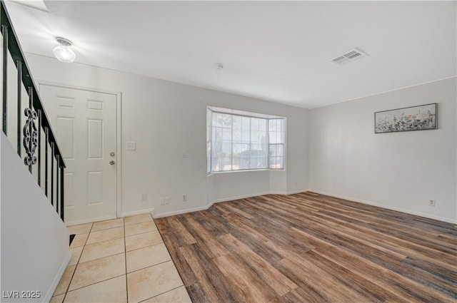 foyer entrance with light hardwood / wood-style flooring