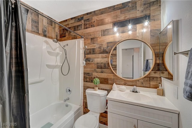 full bathroom with wooden walls, vanity, shower / bath combination with curtain, and toilet