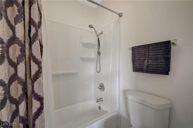 bathroom featuring toilet and washtub / shower combination