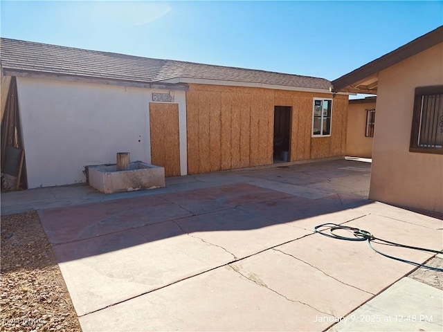 back of house featuring a patio