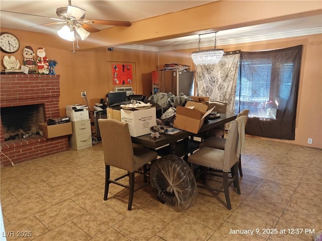 dining room featuring ceiling fan with notable chandelier and a fireplace