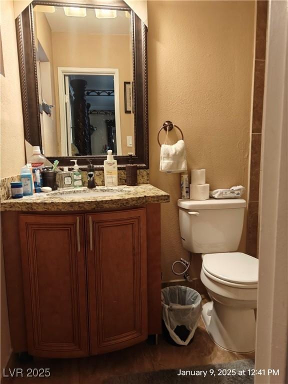 bathroom with vanity and toilet