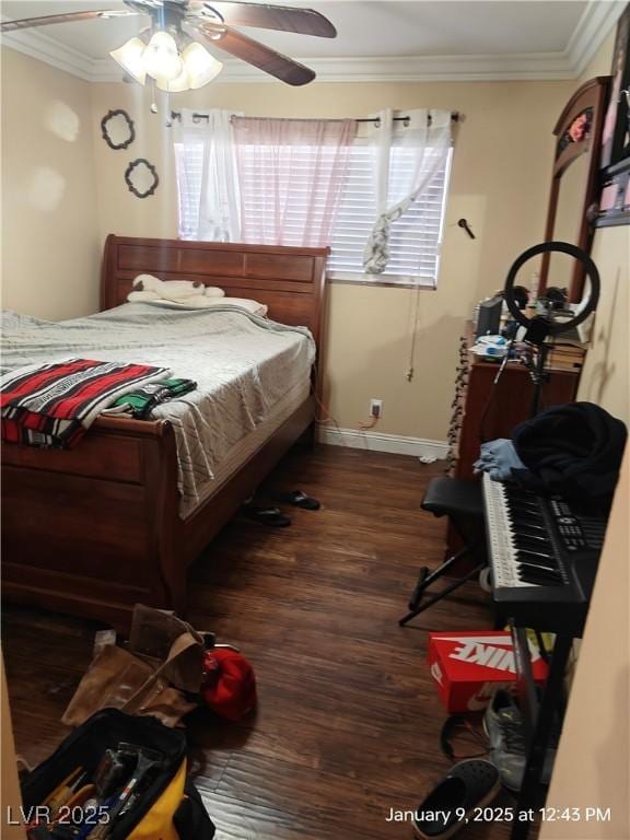 bedroom featuring ceiling fan, dark hardwood / wood-style flooring, and ornamental molding