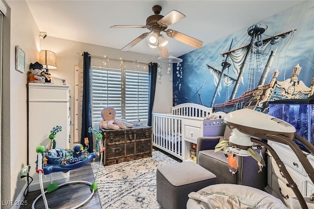 bedroom featuring ceiling fan and hardwood / wood-style floors