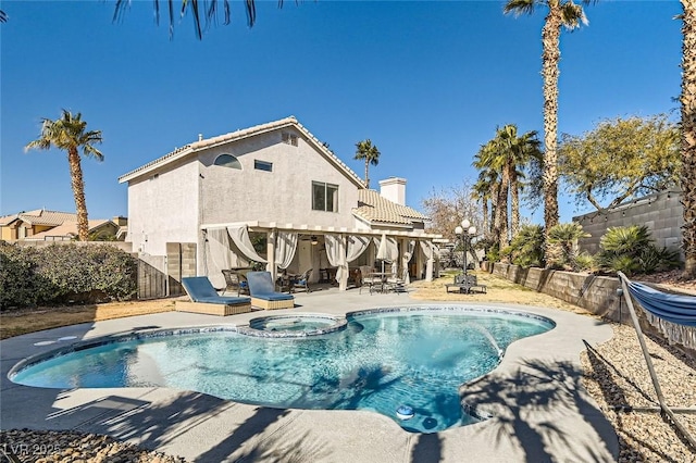 view of swimming pool featuring an in ground hot tub and a patio