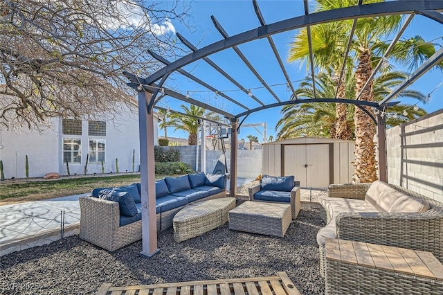 view of patio featuring a storage shed and an outdoor hangout area