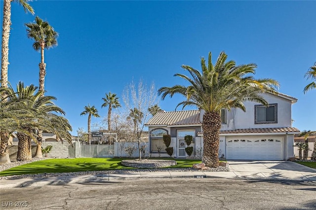 view of front of property featuring a garage and a front yard