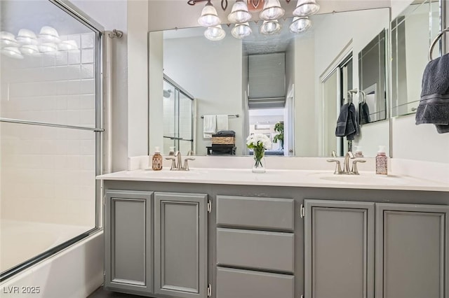 bathroom with vanity and enclosed tub / shower combo