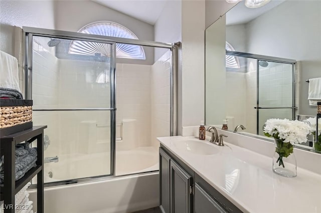 bathroom with vanity and combined bath / shower with glass door