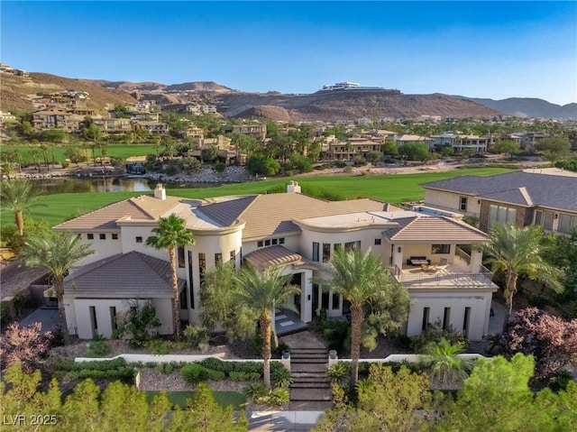 birds eye view of property with a mountain view