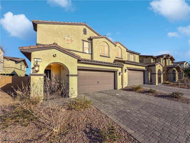 mediterranean / spanish-style house featuring a garage