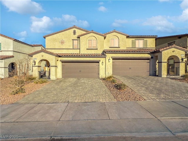 mediterranean / spanish-style home featuring a garage