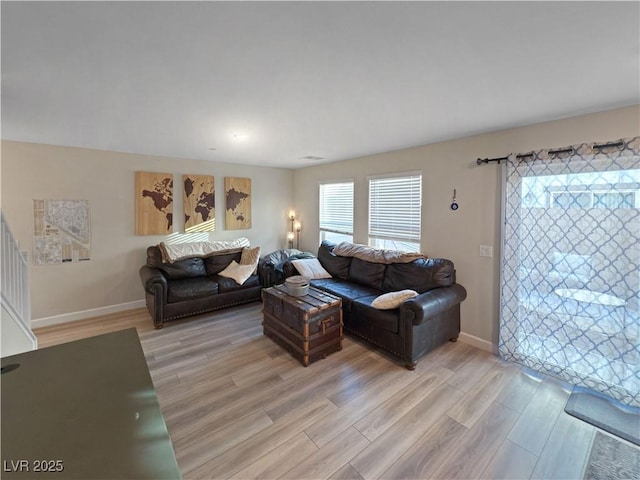 living room with light hardwood / wood-style flooring