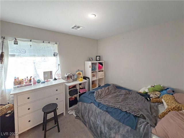 bedroom with light colored carpet