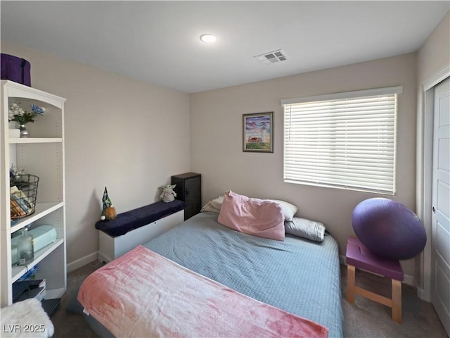 bedroom with dark colored carpet