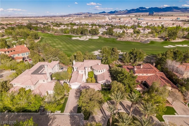 birds eye view of property with a mountain view