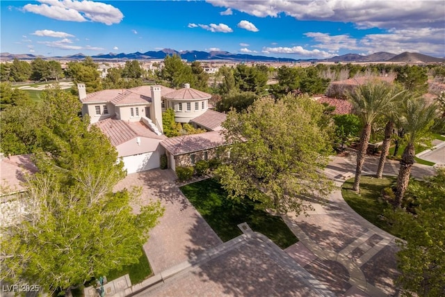 birds eye view of property with a mountain view